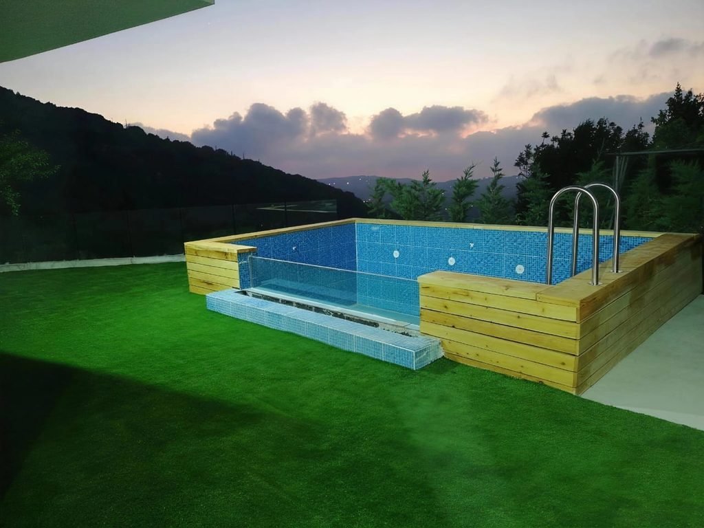 Artificial grass around a swimming pool in Lebanon