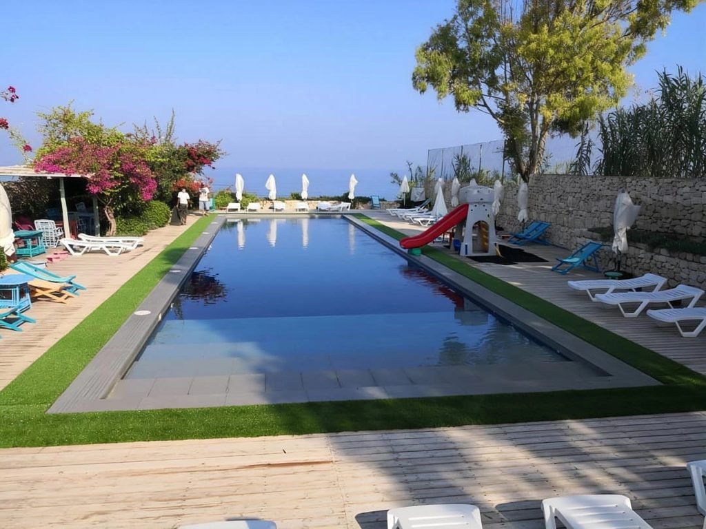 Artificial grass around a swimming pool in Jiyeh, Chouf, Lebanon